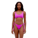 Woman wearing a pink bikini on a white background