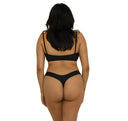 woman wearing a black bikini on a white background
