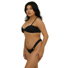 Woman wearing a black bikini on a white background