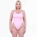 Woman wearing a pink swimsuit on a white background