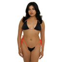 Woman wearing a black bikini with orange straps on a white background