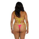 Woman wearing a yellow and pink bikini on a white background