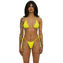 Woman wearing a bright yellow bikini on a white background