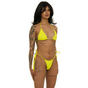 Woman wearing a bright yellow bikini against a white background, sideview.