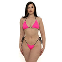 Woman wearing a hot pink bikini with black straps on a white background