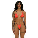 Woman wearing a bright orange bikini with black straps on a white background, front view