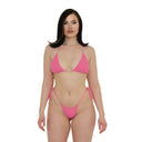 Woman wearing a soft pink textured fabric bikini set on a white background